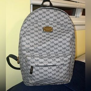 Michael Kors gray backpack with black straps